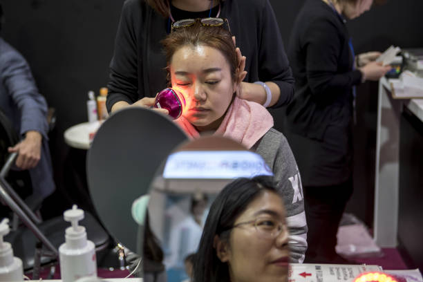 Woman applying skincare product