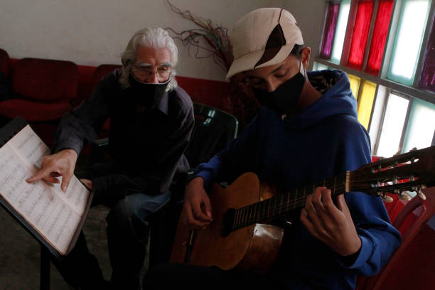 Guitar teacher instructing
