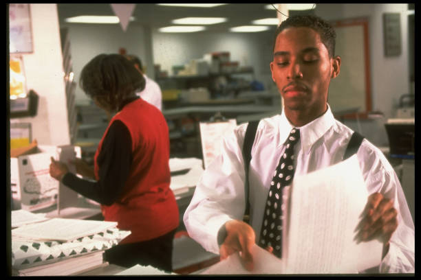 Print shop worker managing orders