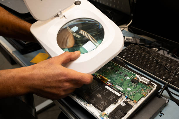 Technician repairing computer hardware