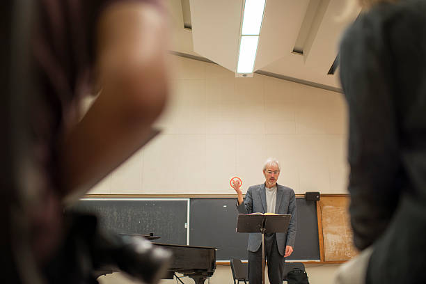 Music teacher conducting class