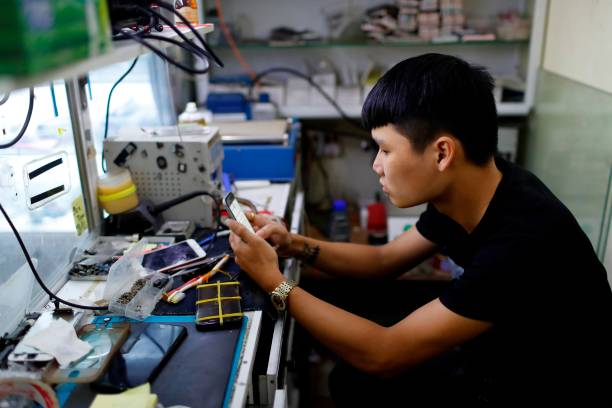 Technician fixing smartphone