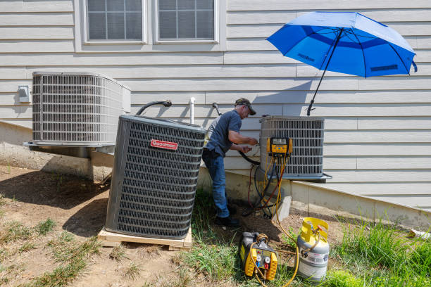 HVAC technician repairing unit