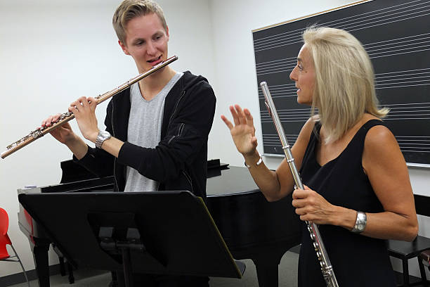Teacher giving flute lesson