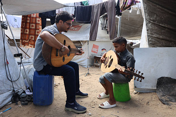 Music teacher with student
