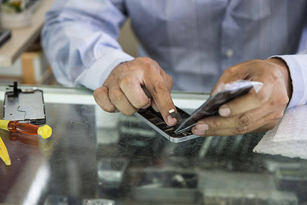 Technician repairing smartphone