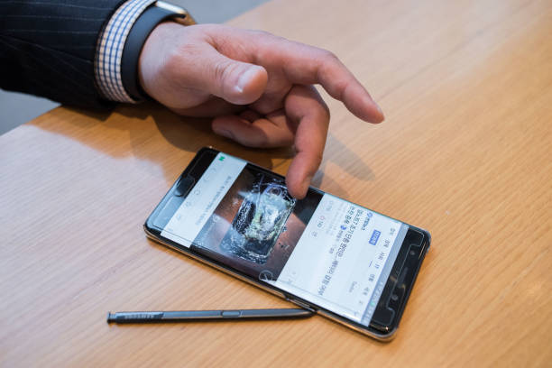 Customer comparing smartphones in store