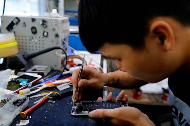 Technician repairing smartphone