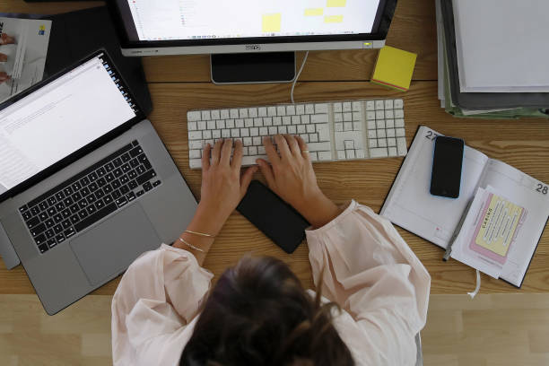 Office worker organizing time management tools