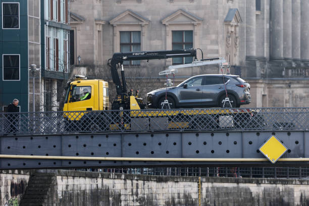 Tow truck recovering vehicle