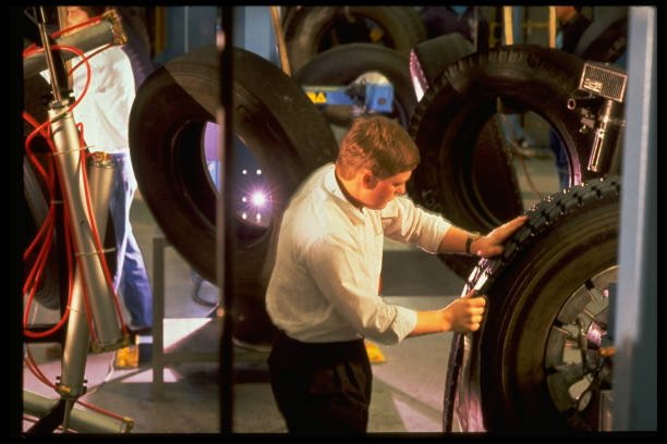 Mechanic replacing car tire