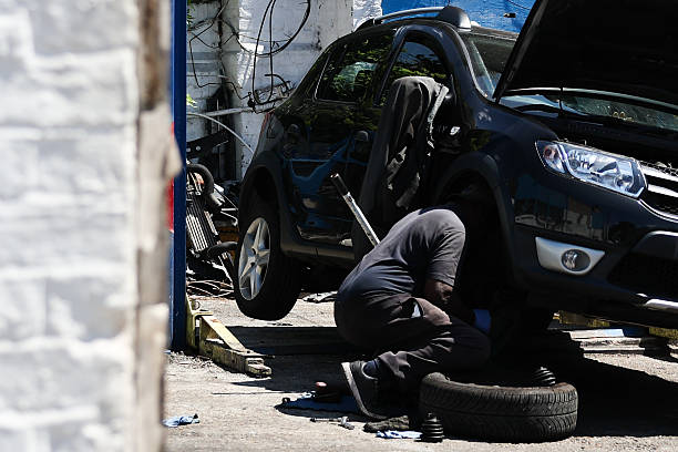 Mechanic replacing car tire