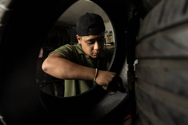 Mechanic changing car tire