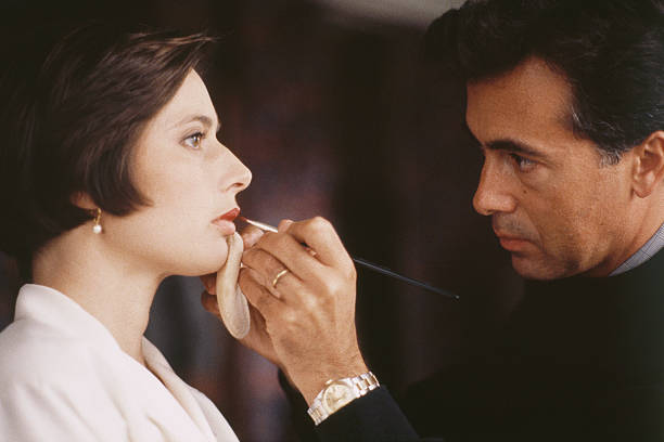 Makeup artist applying lipstick