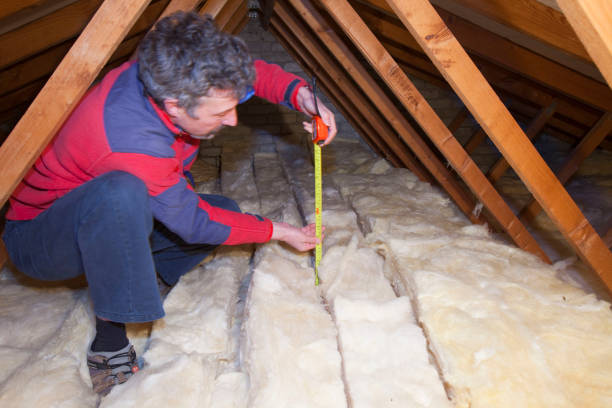 Contractor inspecting insulation
