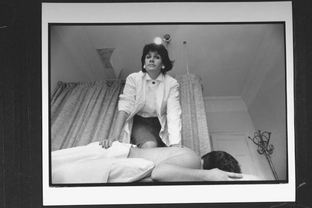 Massage therapist with client