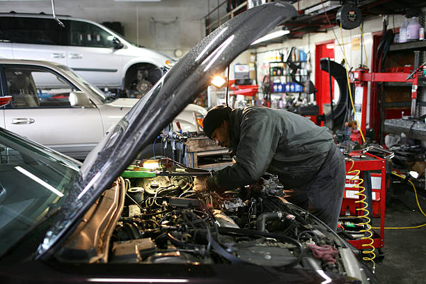 Mechanic servicing car