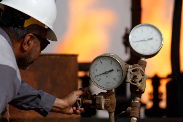 Technician checking gas meter
