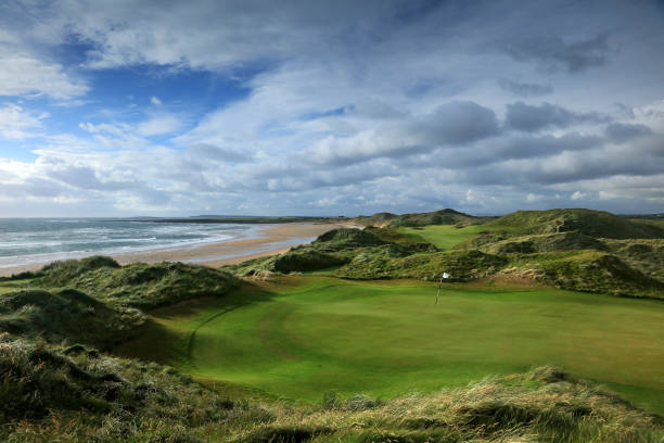 Golfers on coastal course