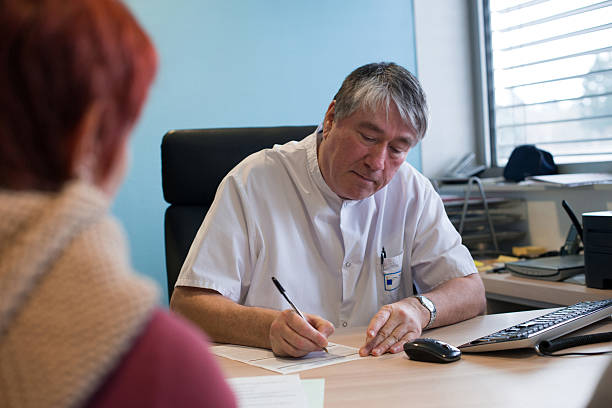 Patient signing insurance form