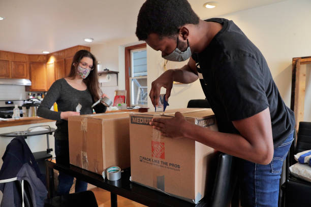 Couple unpacking boxes