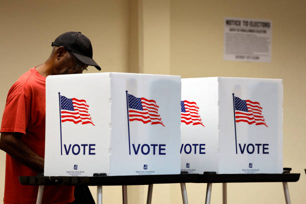 Voter casting ballot