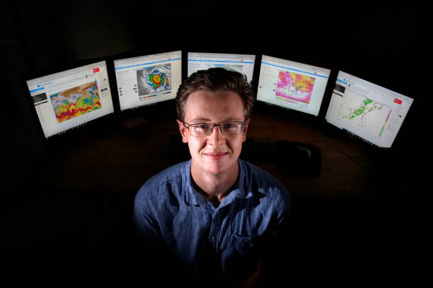 Meteorologist at weather desk
